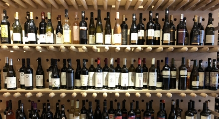 Why is it recommended to buy wine from specialized wine stores?  